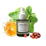 KYOMI spinach leaf exfoliating face toner bottle with spinach leaves, an orange, and grapes on a white background