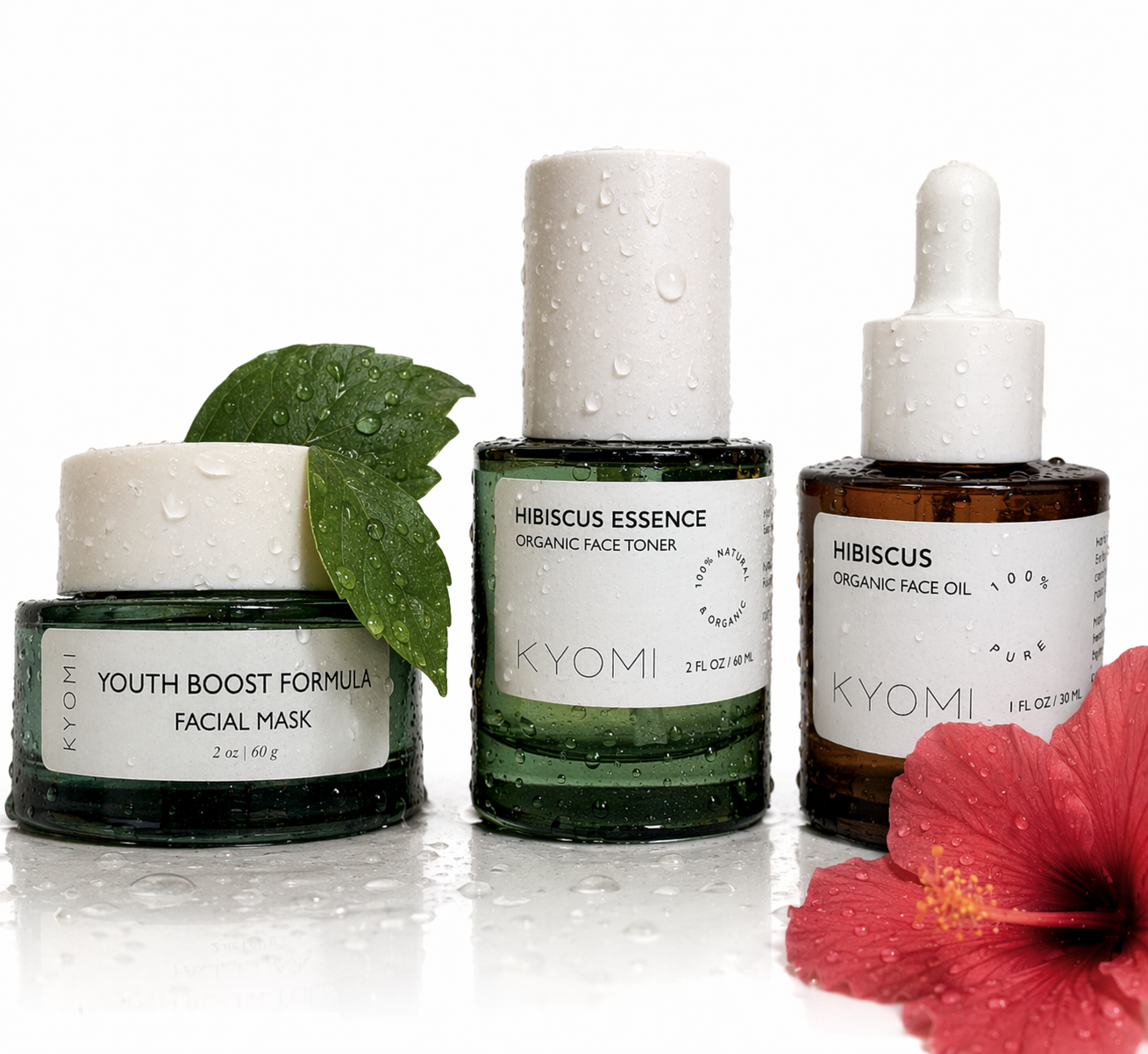KYOMI skincare products including a facial mask, toner, and oil with a hibiscus flower on a white background.