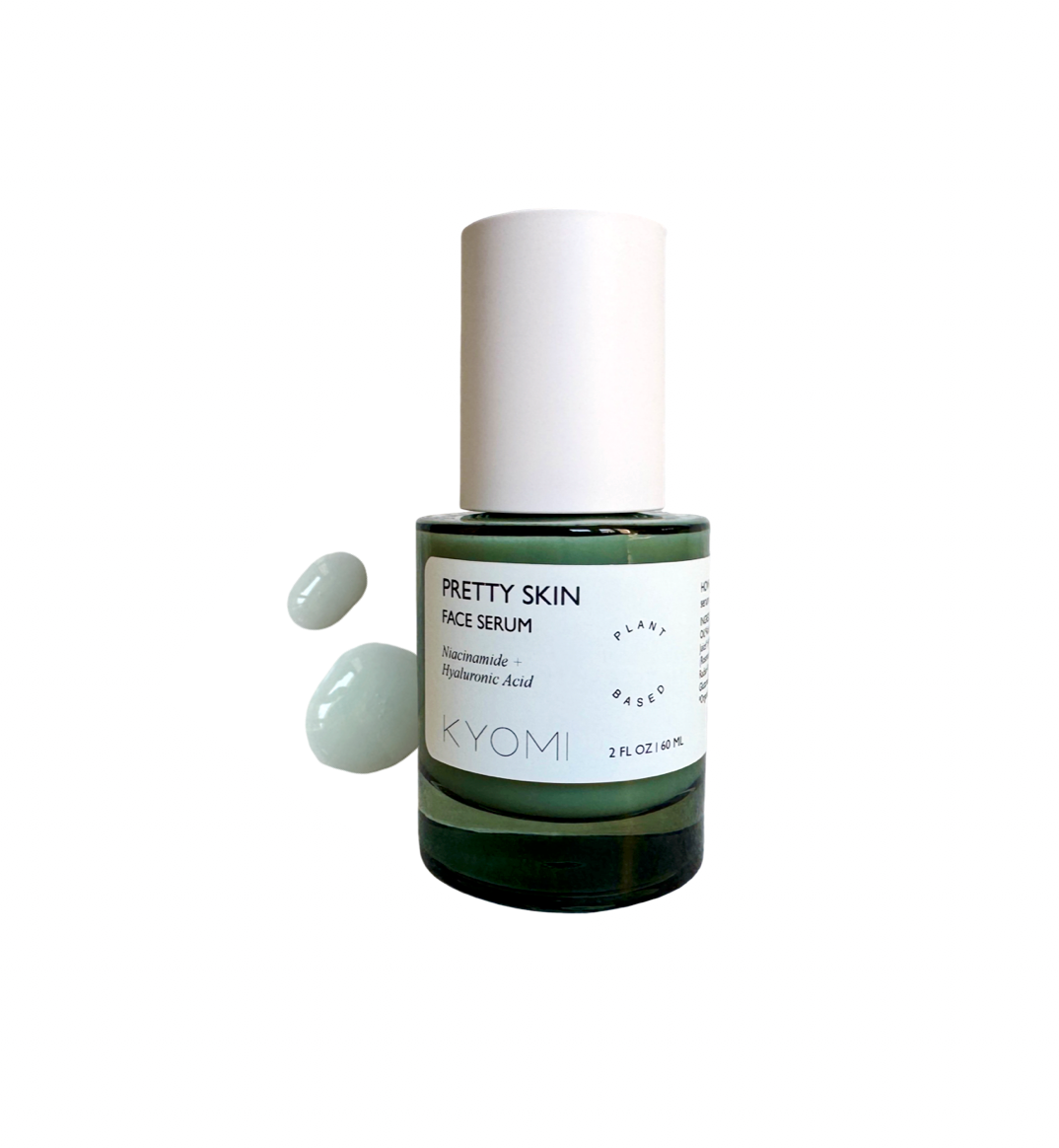 Kyomi Pretty Skin face serum bottle with droplet on a white background