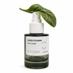 Bottle of KYOMI Super Vitamin Face Toner with a green leaf on a white background