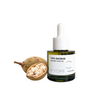 A bottle of KYOMI 100% Baobab Organic Face Oil next to a whole and halved baobab fruit on a solid white background.