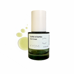 Green face toner bottle with white cap on a white background