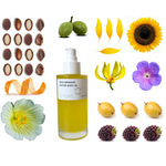 Bottle of KYOMI butter body oil surrounded by various botanical elements on a white background