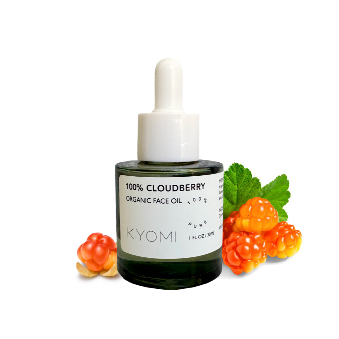 KYOMI 100% Cloudberry Organic Face Oil bottle with cloudberry fruits and leaves on a white background