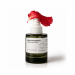 Bottle of Kyomi Hibiscus Essence toner with a red flower on a white background