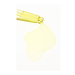 Yellow dropper bottle with liquid on a white background
